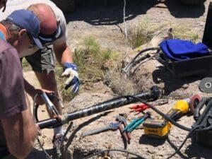 A man working on an electrical wire.