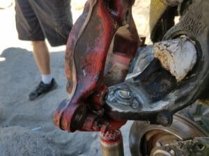 A red fire hydrant with rust on it.