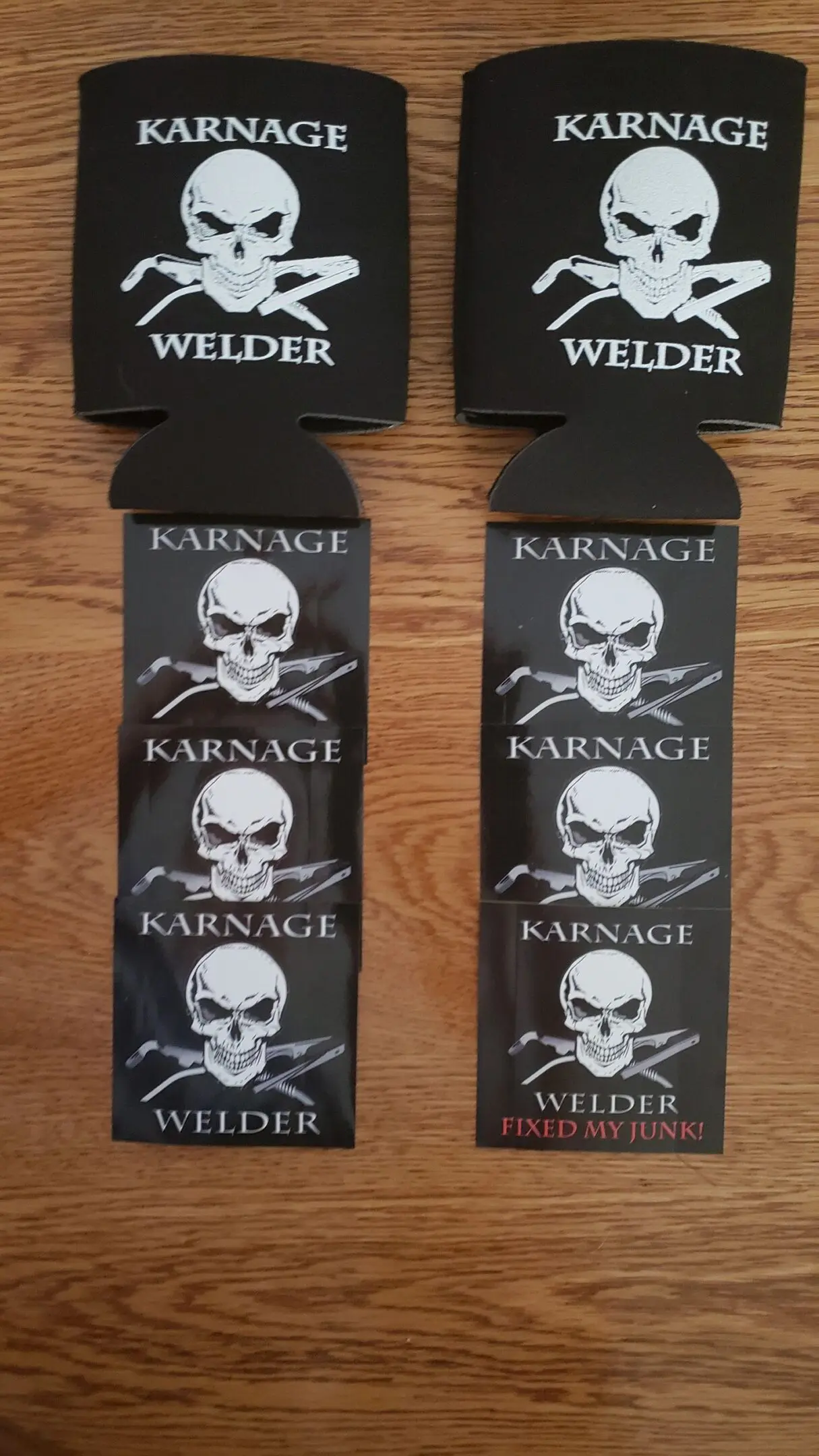 Two beer holders with a picture of skulls and swords.