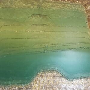 A green slab of concrete with some water on it