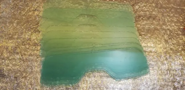 A green slab of concrete with some water on it