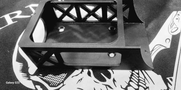 A black and white photo of a bench