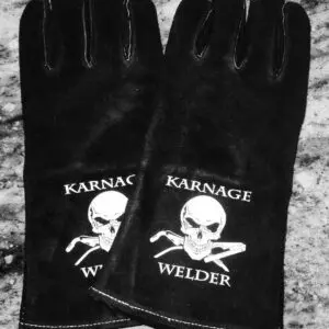 A pair of black gloves with a skull and crossbones on them.