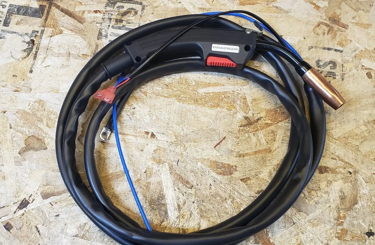 A black wire with red and blue wires on it.