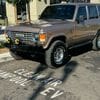 A brown suv parked on the side of a street.